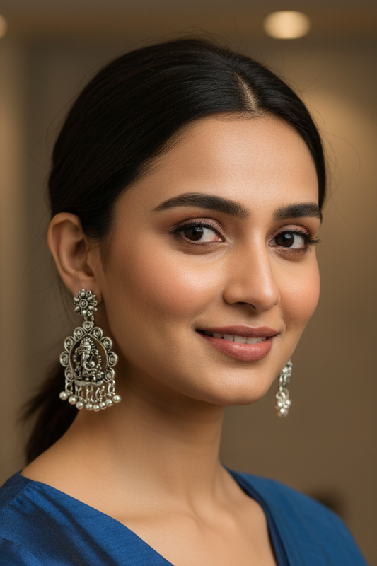 Woman wearing traditional earrings with a blurred background